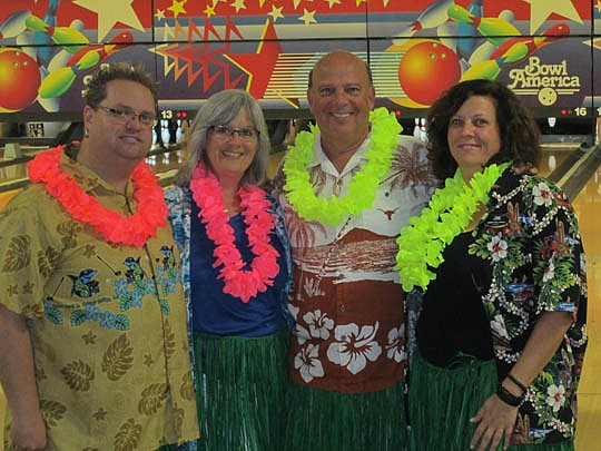 Andrew Bell, The Legends of Real Estate East Coast; Diane Cook, Exit Real Estate Gallery; Marc Jernigan, Watson Realty; and Annette Large, Exit Real Estate Gallery, at the Women's Council of Realtors' bowling tournament.