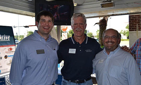 Members of the Executive Committee beam at the results of the 2015 Membership Drive: Executive Director Corey Deal, Second Vice President Harlan Bost and NEFBA President Rick Morales.