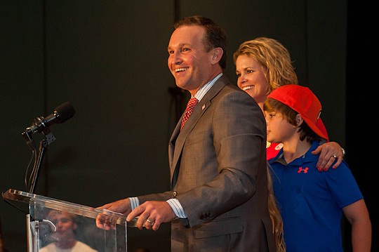 Mayor-elect Lenny Curry thanks a cheering crowd after he defeated Mayor Alvin Brown. Also pictured are Curry's wife, Molly, and their son, Boyd. They also have two daughters, Bridget and Brooke.