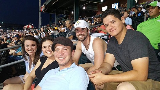 NEFBA Events Coordinator Corey Hacker (far left) cheers on the Suns with members from Professional Sunshine Roofing and Greene Quality Construction.