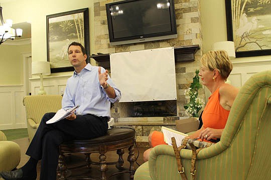 Doug Davis, president of Fletcher Management Co., a mixed-use developer, said residential projects moving forward in St. Johns County have the power to bring more retail into the area. With Davis is Fletcher Project Administrator Vanessa Cunningham.