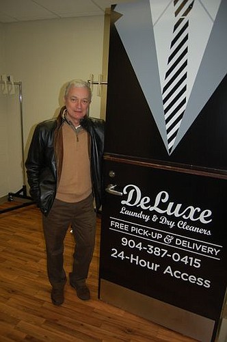 Carter Funk, managing member of CKF Laundry Services, at DeLuxe Laundry & Dry Cleaners' new "satellite store" at Riverplace Tower.