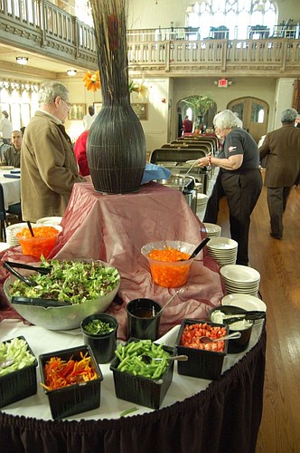 The buffet begins with salad and ends with dessert.
