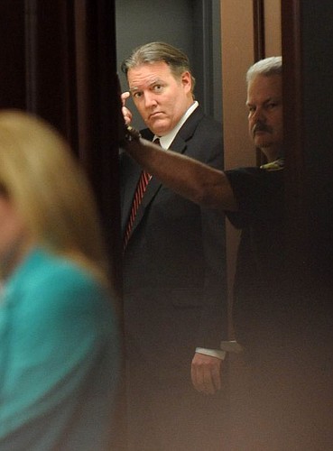 Michael Dunn leaves the courtroom after the verdict was read Saturday. Dunn was convicted of three counts of attempted second-degree murder, but jurors could not agree on the most serious charge of first-degree murder. (The Florida Times-Union, Bob Ma...
