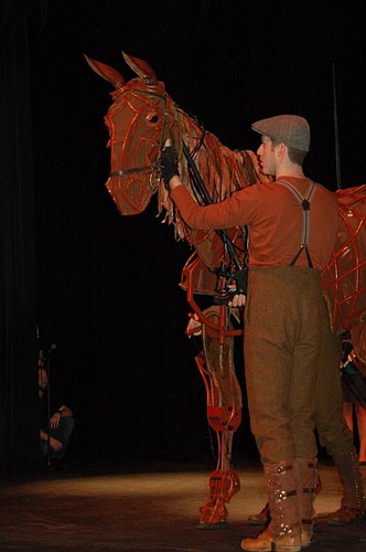 One puppeteer operates Joey's head while two others inside the puppet operate the "heart" and "hind."