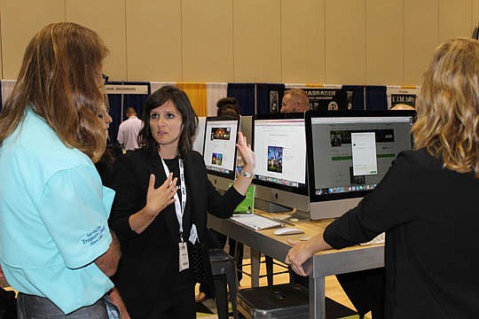 Sales associates from Houzz.com demonstrated how to set up a profile and load photos onto their home design and remodeling site at the annual Southeast Building Conference in Orlando. The team also was in town to pitch the benefits of using local mark...