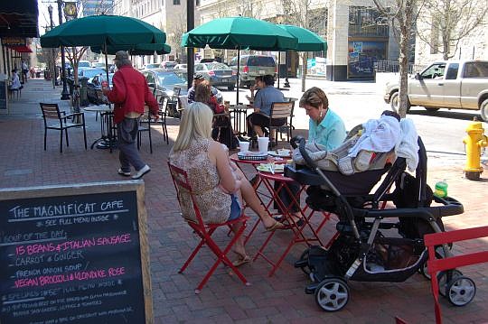 The sidewalk tables at Magnificat CafÃ© and Chamblin's Uptown were doing good business Tuesday.