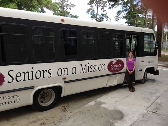 Joanne Hickox arranges nonprofit work for the 275 senior participants in Seniors on a Mission, which she formed after a decade of volunteering with society's older members. The bus - she needs a larger one - picks up volunteers for transport to worksites.