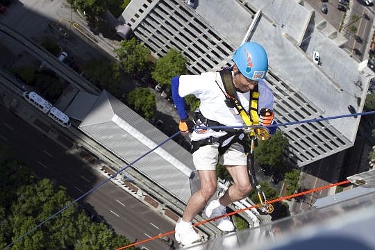 Carlos Semidei from WJCT TV-7 makes his way down the EverBank Center on Saturday.