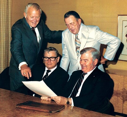 Clockwise from top left, J.J. Daniel, Robert Feagin, Tom McGehee and Laurence Lee Jr. sign the charter for the Greater Jacksonville Area Community Foundation in 1964. The organization later changed its name to The Community Foundation.