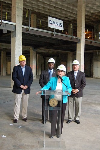 Jessie Ball duPont Fund President Sherry Magill (at podium), was joined by, from left, Deputy Clerk of Court Derek Igou, Mayor Alvin Brown and Duval County Tax Collector Michael Corrigan on Thursday for an announcement of proposed new Downtown parking...