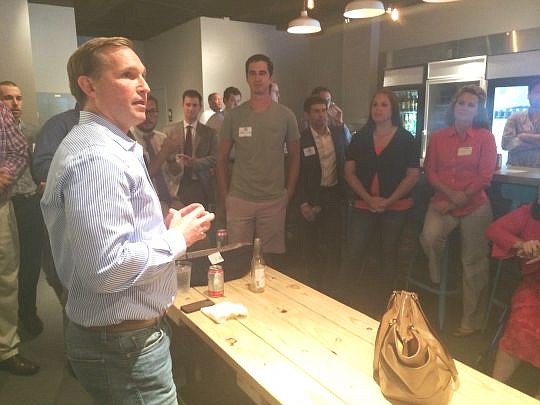 Mayoral candidate Lenny Curry talks to millenial-age supporters during a June 30 fundraiser at BREW Five Points.