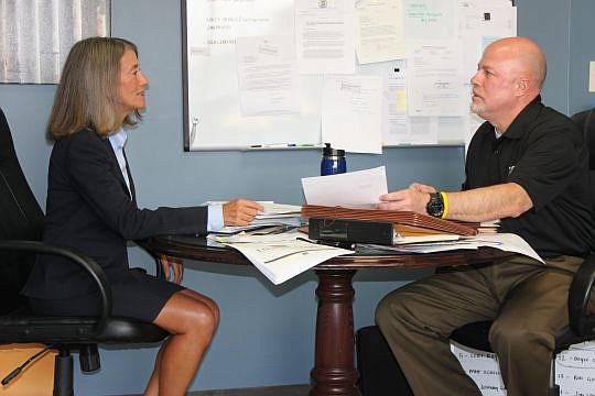Lynn Drysdale, Jacksonville Area Legal Aid consumer law unit head, and Jim Kowalski, the organization's executive director, in a meeting at JALA's Downtown offices. A bill being drafted would provide up to $1 million in additional city funding for the...