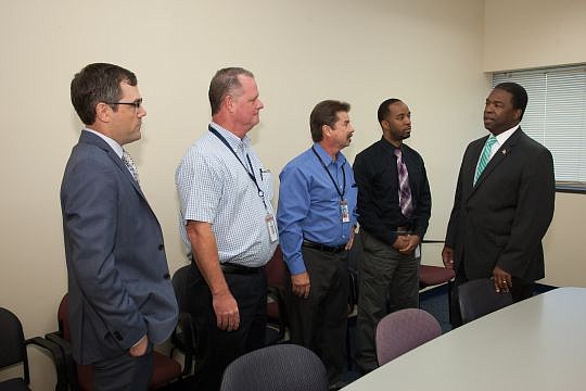 Mayor Alvin Brown hosted a celebration of the city&#039;s summer jobs programs. Also pictured are Matt Galnor, representing the JAX Chamber; Kent Brumfield, JEA fleet services manager; David Nechvatal, JEA water meter services manager; and Christopher...