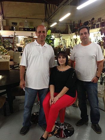 From left, Sam Kassab, his wife, Rola Kassab, and his brother, Tony Kassab, want to resume furniture imports at Mary's Wholesale Furniture.