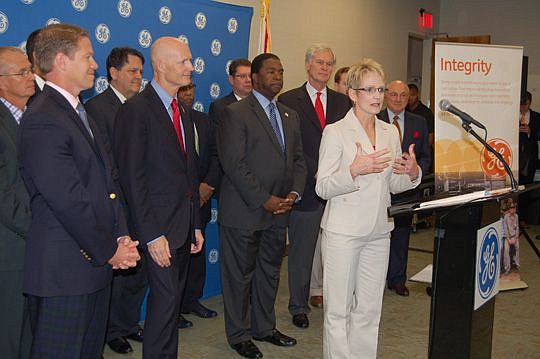 GE Measurement & Control Vice President of Global Supply Chain Julie DeWane (at podium) Friday morning announced the company is creating a new facility at Cecil Commerce Center. She was joined by Gov. Rick Scott, Mayor Alvin Brown and other officials.