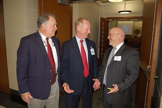 From left, Florida American Board of Trial Advocates President Robert C. Palmer III; Duval County Public Schools Grants Coordinator Phillip Little; and Scott Costantino, president-elect of the ABOTA Jacksonville chapter.