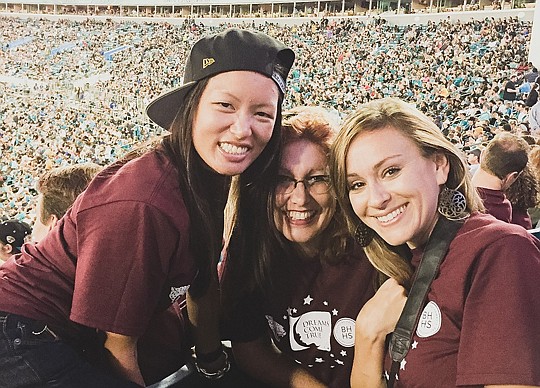 Berkshire Hathaway HomeServices Florida Network Realty celebrated with a team tailgate party at EverBank Field at the Jacksonville Jaguars' game against the Tennessee Titans. Above, Jan Ostler-Walker, center, of the firm's Beaches office, enjoys the g...