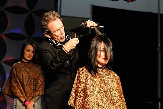 Michael O'Rourke, celebrity hair stylist and owner of Rock Your Hair, demonstrates his techniques on stage with Casey Wooten-Smith. O'Rourke was one of several celebrities who are taking part in the Southern Women's Show.