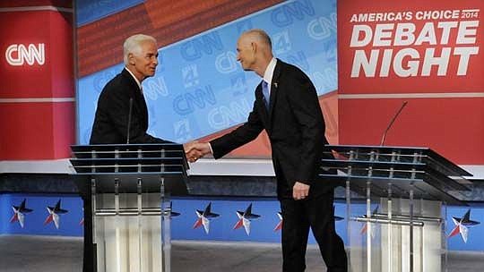 Republican Gov. Rick Scott (right) and Democratic candidate Charlie Crist shake hands before Tuesday's debate in Jacksonville.