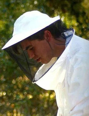 Justin Stubblefield works with bee hives. He wants to sell his honey products to Winn-Dixie.