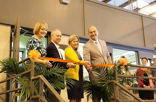 From left, Cheryl Grymes, Duval County Public Schools board member; Parker McCrary, Dignity U Wear board president; Becki Couch, school board chair; and Nikolai Vitti, school superintendent, cut the ribbon at the "New Clothes Closet."