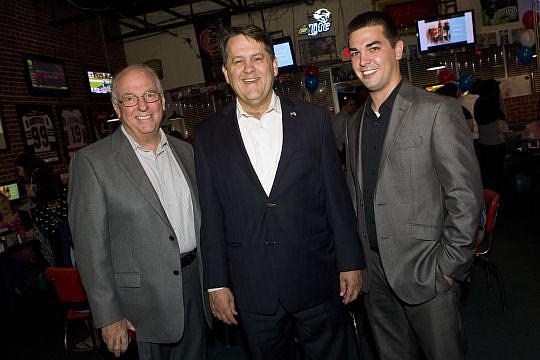 State Rep.Â Charles McBurney, center, was re-elected last night against a write-in candidate. Pictured with the Republican lawmaker are Mike Miller, left, and Adam Miller, who is McBurney's aide.