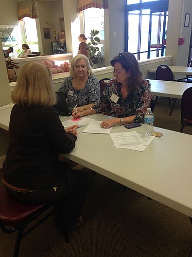 Margaret Costa and Debbie Lee-Clark create advance directives at Pablo Towers.