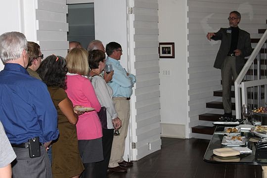 Two-term City Council member Bill Bishop talks to supporters during a late October fundraising event at architect John Zona's residence. Bishop surprised many when he announced in April he was running for mayor.