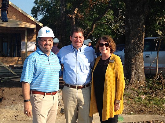 NEFBA President Rick Morales, Jacksonville City Council President Greg Anderson and HabiJax CEO/President Mary Kay O'Rourke stand outside the 24-hour build home, which was the 2015 president's project. See Morales' monthly column on Page 32.