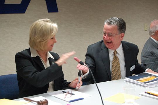 JEA interim board Chair Lisa Weatherby was congratulated by CEO Paul McElroy after she adjourned the first meeting after the resignation of former board Chair Mike Hightower.