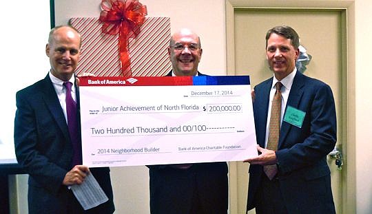 From left, Gregory B. Smith, Northeast Florida market president for Bank of America, presents the Neighborhood Builders Award to Junior Achievement of North Florida CEO Steve St. Amand and board Chair Charlie Kauffman. The donation represents an unres...