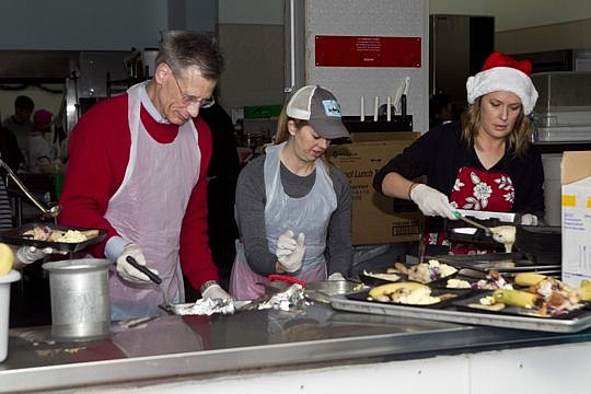 Jerry Hoffman, left, Karen Williams and Yolan Tanner volunteered to serve Christmas Day breakfast to Sulzbacher residents.