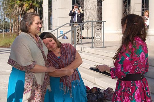 Jennifer Royael, left, and Cassondra Rogers were married Tuesday in front of the Duval County Courthouse.