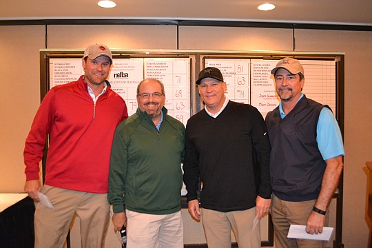 The winning Nichiha team is congratulated by 2015 NEFBA President Rick Morales, second from left. Also pictured are Jeff Knauff, Nichiha; Andy Chambers, Mastercraft Builder Group; and Glenn Layton, Glenn Layton Homes.