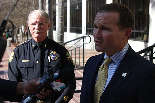 Mayoral candidate Lenny Curry criticizes Mayor Alvin Brown's anti-crime initiative announced Friday as Sheriff John Rutherford looks on. The sheriff is backing Curry in the upcoming election and called Brown's programs "government by announcement."