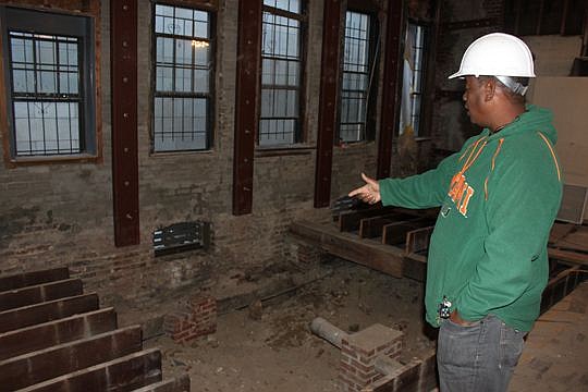 Project Manager Robert Tripp of JL Tripp Builders explains the work underway at Snyder Memorial in the heart of Downtown. Excavation in a side room was needed to reinforce the building's southern wall that had deteriorated.