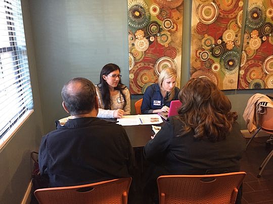 Attorney Jeanna Field and student Cara Dickinson assist seniors with advance directive documents at a Feb. 7 clinic.