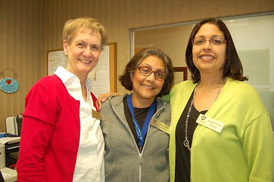From left, Joyce Davis has performed more than 500 hours of volunteer service, Vineetha Loke has more than 1,000 hours and Virginia Chemaly has surpassed the 500-hour mark.