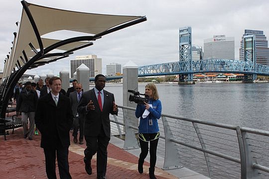 City Council President Clay Yarborough and Mayor Alvin Brown lead the first tour Thursday of the newly renovated Southbank Riverwalk. The $17 million project replaced a rotting wooden boardwalk with concrete and pavers, and includes several other upgr...
