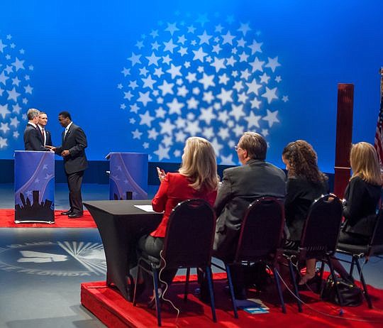 The three mayoral candidates - Bill Bishop, Lenny Curry and Mayor Alvin Brown - congratulate one another and chat at the conclusion of the debate. The next debate is Wednesday at Jacksonville University. Members of the panel were Heather Crawford from...