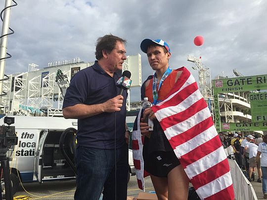 True is interviewed by sports director Sam Kouvaris of WJXT TV-4 after winning the Gate River Run.