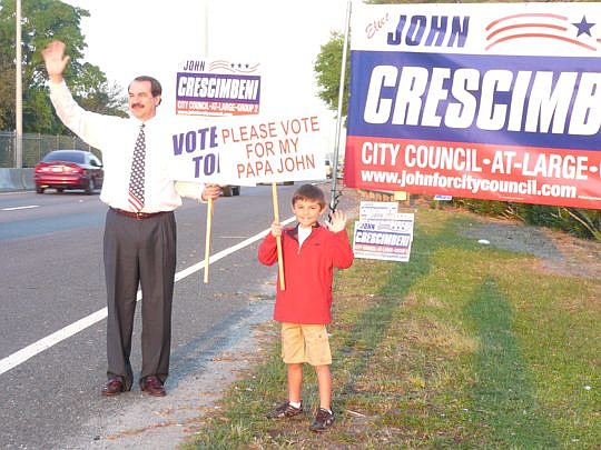 Longtime City Council member John Crescimbeni isn't a stranger to campaigning. Shown above with his grandson, Tyler, Crescimbeni is trying to defend his At-Large Group 2 seat.
