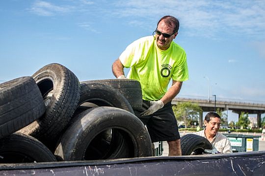 City Council member John Crescimbeni helped unload tires during last year's event to buy old tires and signs.