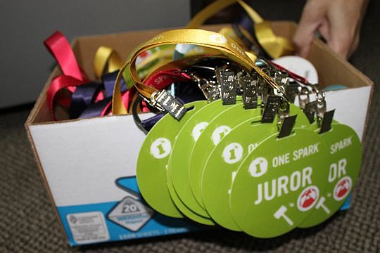 Jurors, creators and just about everyone associated with putting on One Spark will have similar badges. This boxful is in Murphy's office, although there are many others around the One Spark offices.