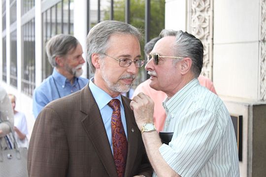 Former mayoral candidate Bill Bishop receives words of encouragement from supporter Dale Parsons after a news conference Tuesday. Bishop announced he wasn't supporting either candidate in the May 19 runoff and also would be running for mayor in 2019.
