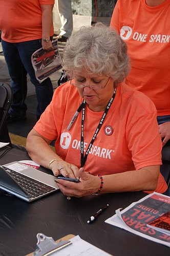 Bobbi Mercer is volunteering for the second consecutive year. A real fan of the festival, Mercer said when she gets married in July, there will be a three-dimensional rendition of the One Spark logo on top of her wedding cake.