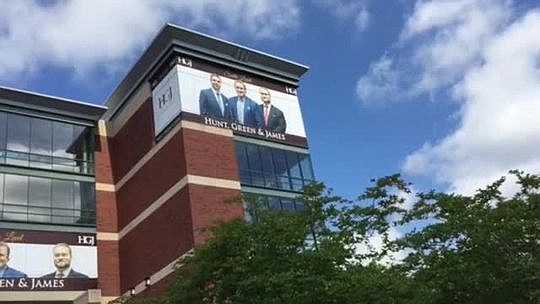 The Office of General Counsel issued an opinion  Wednesday that said the signs on Veterans Memorial Arena violate city and state laws. (Photo from news4jax.com)