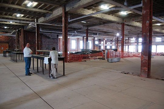 This image from September 2012 shows the historic postal corridor and the writing tables that will be restored to complete the work required at the Ed Austin Building.