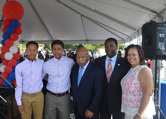 U.S. Rep. John Lewis of Georgia, center, was in town Sunday for a get-out-the-vote rally for Mayor Alvin Brown. The mayor's sons, Jordan and Joshua, and his wife, Santhea, also took part in the event.